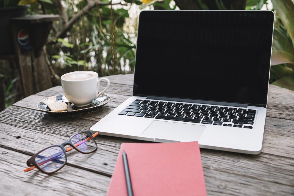 notebook-glasses-near-laptop-cup.jpg